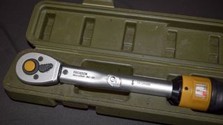 Torque wrench in a green case