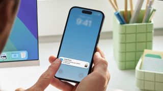 Phone showing Ring Video Descriptions AI feature.