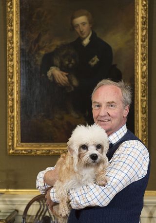 Richard Scott, the 10th Duke of Buccleuch pictured with Bowhill’s resident Dandie Dimmont, Lucy at Bowhill House near Selkirk, Scotland. (Picture: ©Country Life/Ian Rutherford)