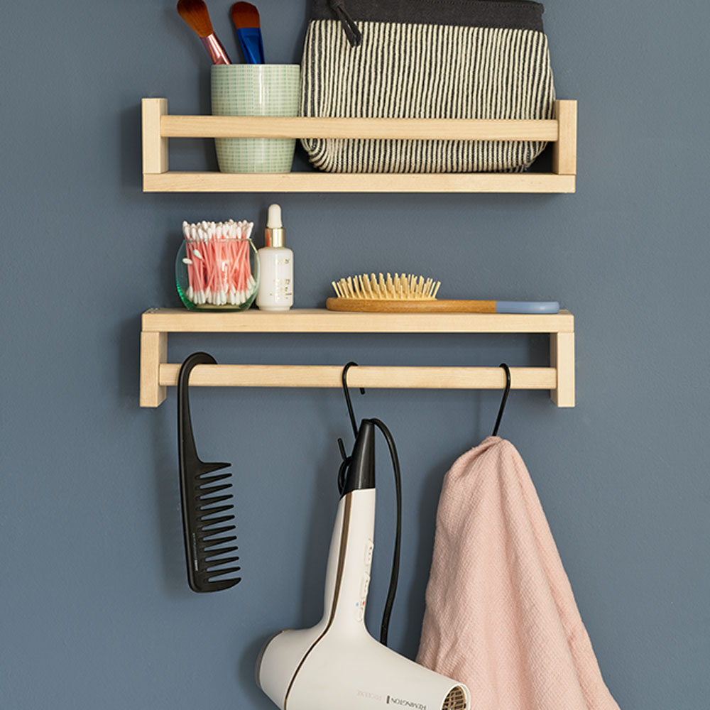 blue wall with shelf and hair dryer