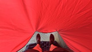 The interior of a red bivy shelter