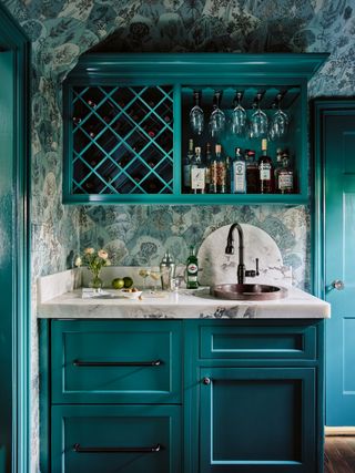 a blue wet bar with gloss cabinets