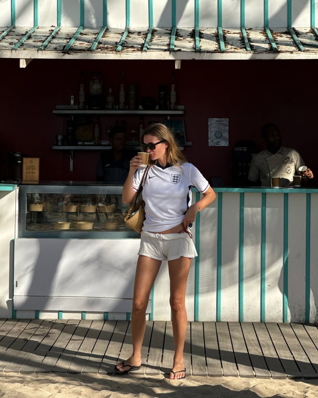 woman wearing white mini shorts with white t-shirt