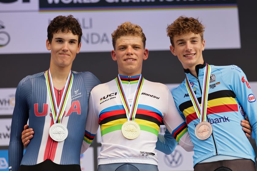 Picture by Alex Whitehead/SWpix.com - 23/09/2025 - Cycling - 2025 UCI Road World Championships - BK Arena to Kigali Convention Centre, Kigali, Rwanda - Men Junior Individual Time Trial (ITT) Podium - Michiel Mouris (Netherlands) receiving the Gold Medal to become World Champion with Ashlin Barry (USA) receiving the Silver Medal and Seff van Kerckhove (Belgium) receiving the Bronze Medal