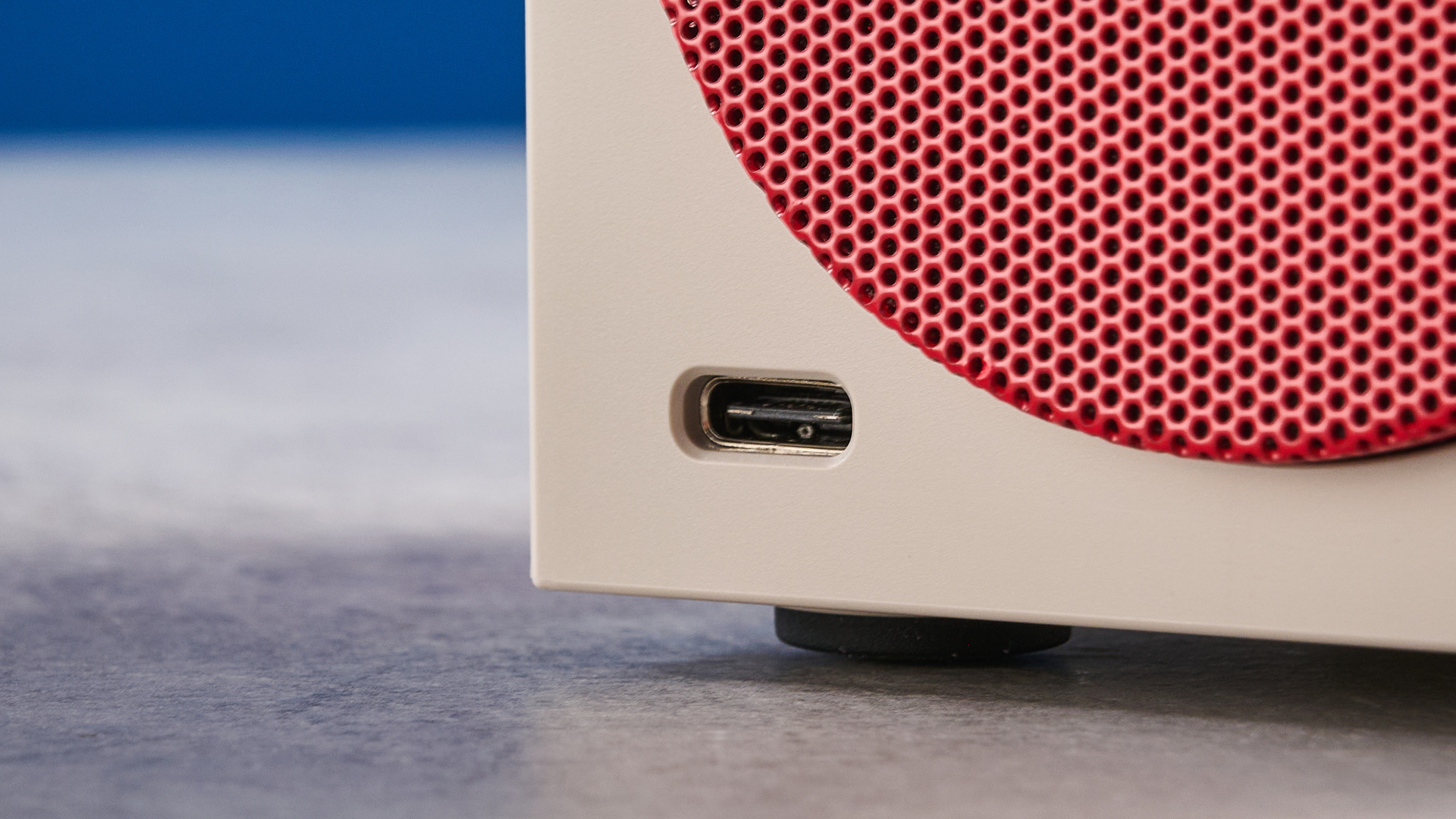 A beige, red and black 8BitDo Retro Cube 2 Bluetooth speaker