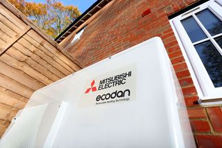 Mitsubishi's Ecodan hybrid heat pump on exterior of home