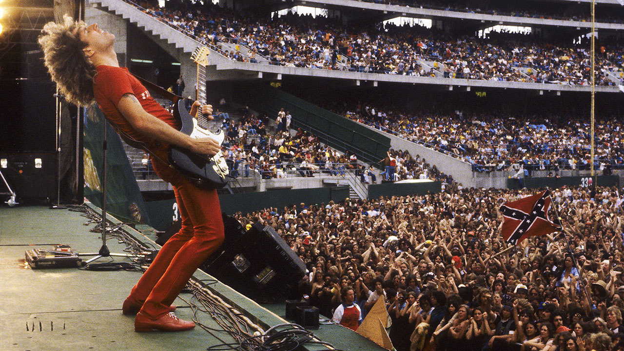 A photograph of Sammy Hagar on stage at Oakland Stadium in 1979