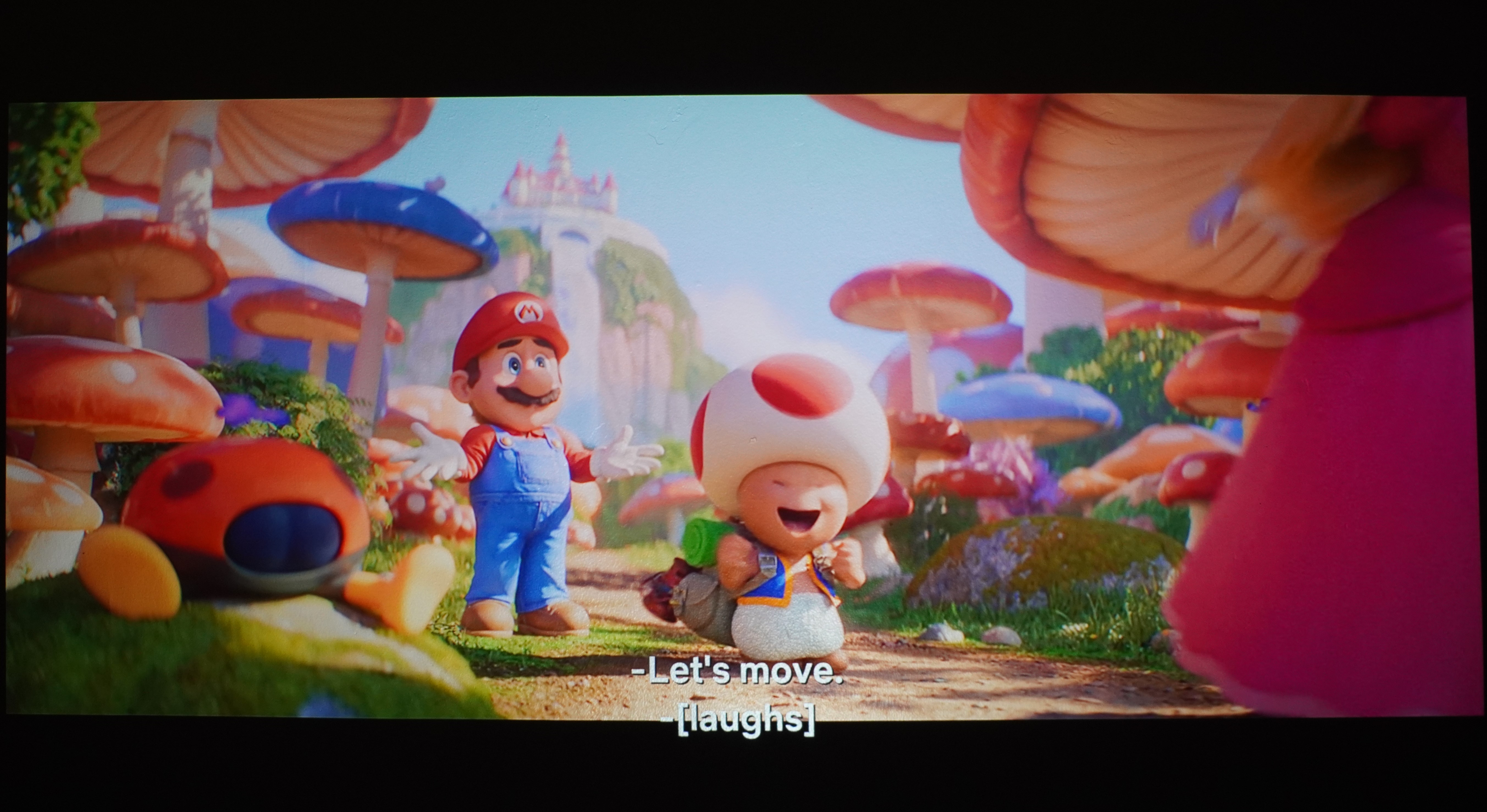 BenQ X300G projector showing Super Mario movie