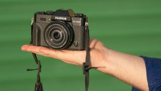 Hand holding a Fujifilm X-T20