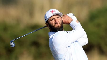 Jon Rahm hits an iron shot at the 2024 Alfred Dunhill Links Championship