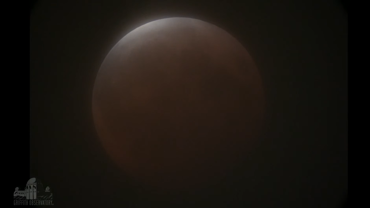 The full moon on May 26, 2021, just as totality of the lunar eclipse was ending, as seen from Griffith Observatory near Los Angeles.
