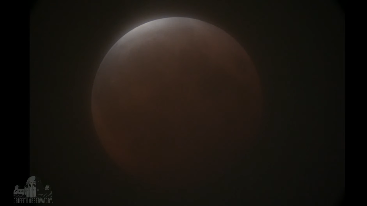The full moon on May 26, 2021, just as totality of the lunar eclipse was ending, as seen from Griffith Observatory near Los Angeles.