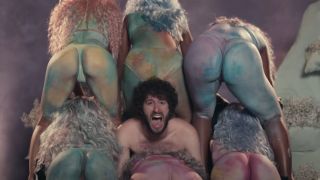 Lil Dicky surrounded by women's butts
