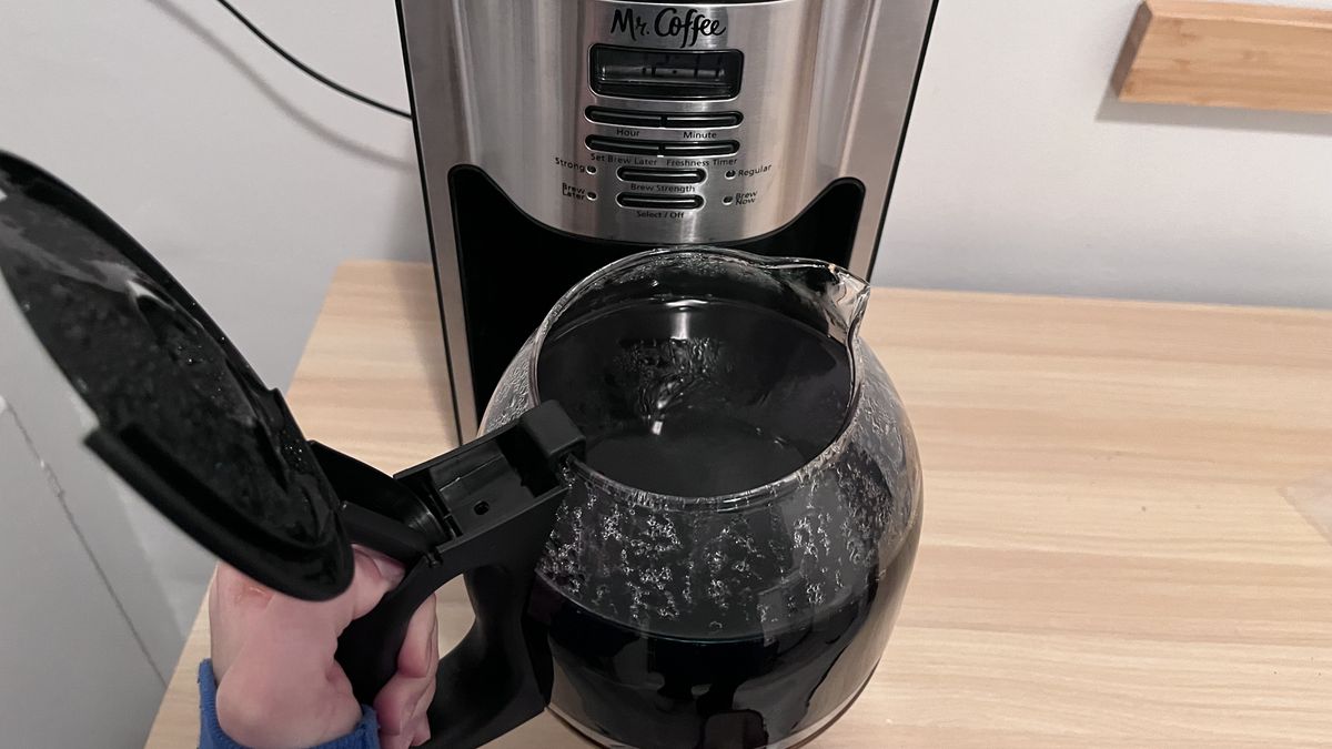 Mr. Coffee 12 Cup Programmable Coffee Maker with a carafe of coffee