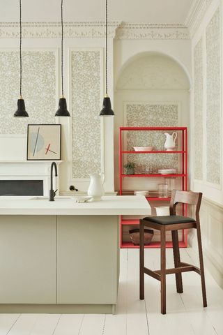 cream kitchen with island and red shelves