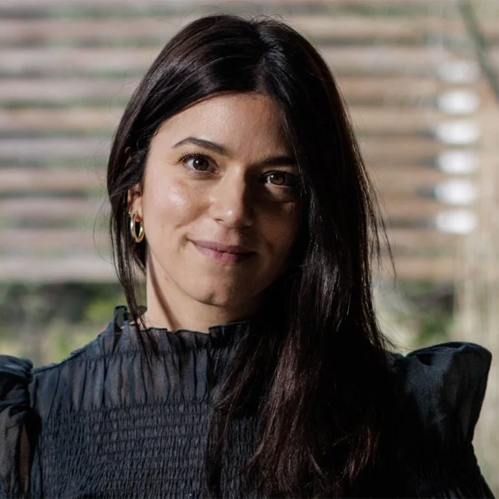 Francesca Yarnit headshot wearing a black blouse