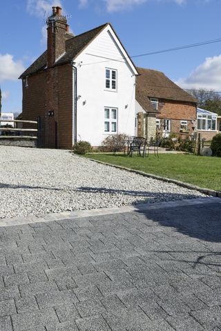 front garden with block paving and gravel driveway