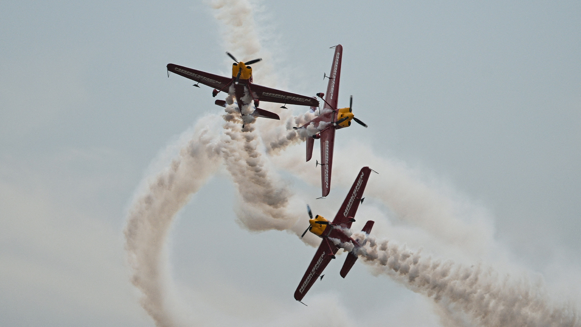 The Marksmen aerobatic team from South Africa performs during the Aero Asia aerospace exhibition in Zhuhai, China