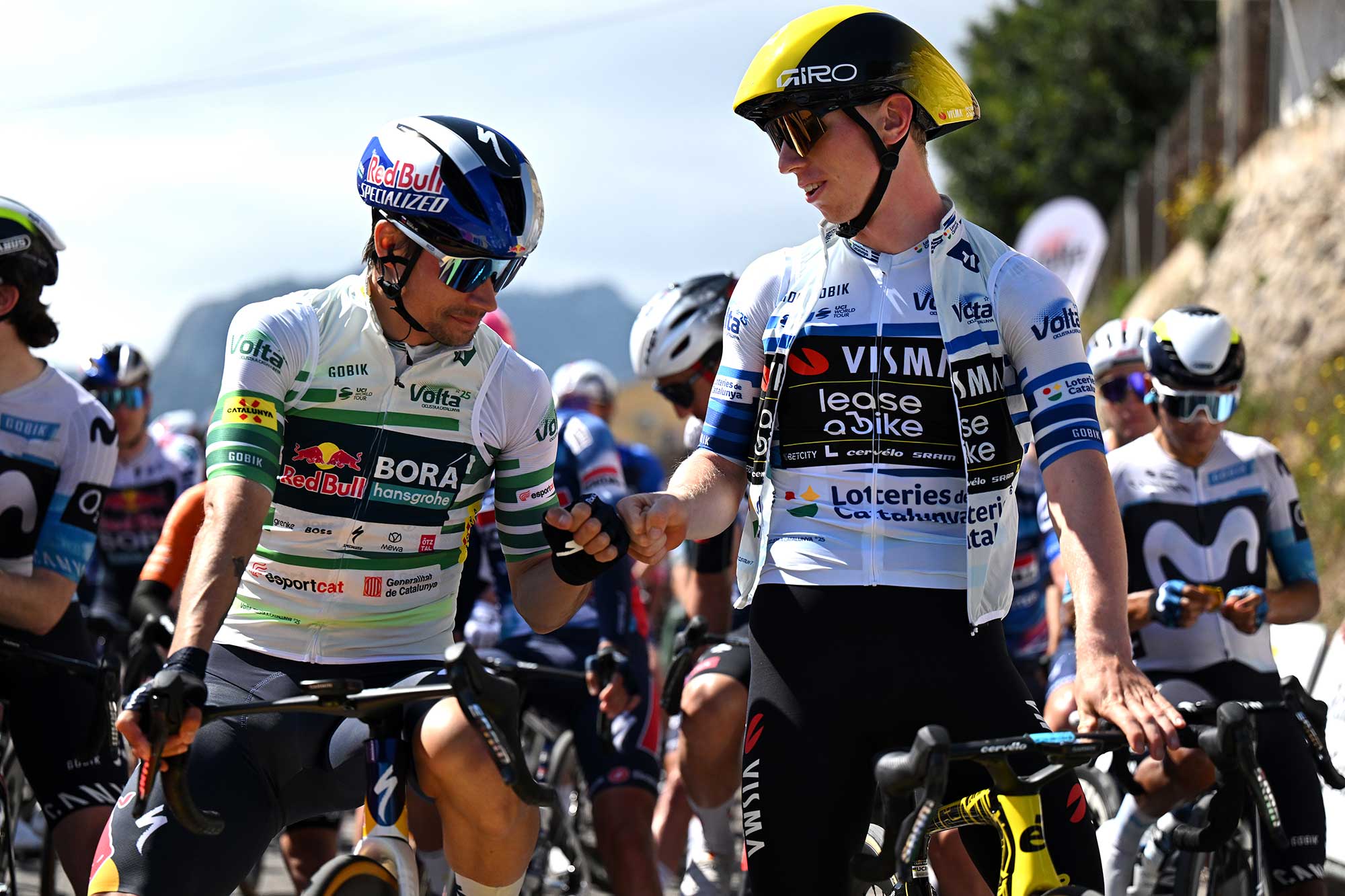 PAULS, SPAIN - MARCH 28: (L-R) Primoz Roglic of Slovenia and Team Red Bull- BORA - Hansgrohe - Green Leader Jersey and Matthew Brennan of United Kingdom and Team Visma | Lease A Bike - Blue Points Jersey prior to the 104th Volta Ciclista a Catalunya 2025, Stage 5 a 165.9km stage from Pauls to Amposta / #UCIWT / on March 28, 2025 in Pauls, Spain.