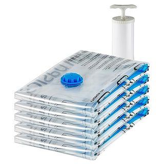 A stack of 5 Amazon Basics Vacuum Compression Zipper Storage Bags With white Hand Pump