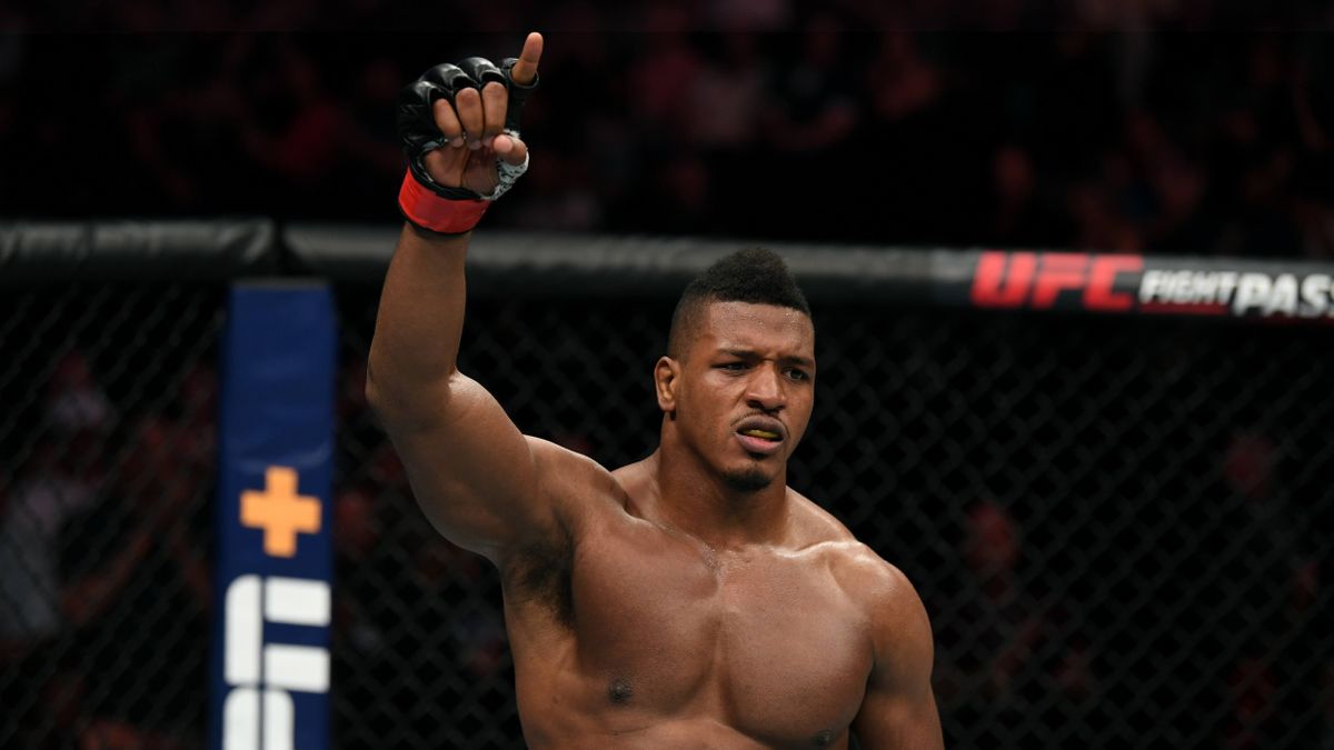 UFC 260 Prelims fighter Alonzo Menifield celebrates in the cage after a victory.