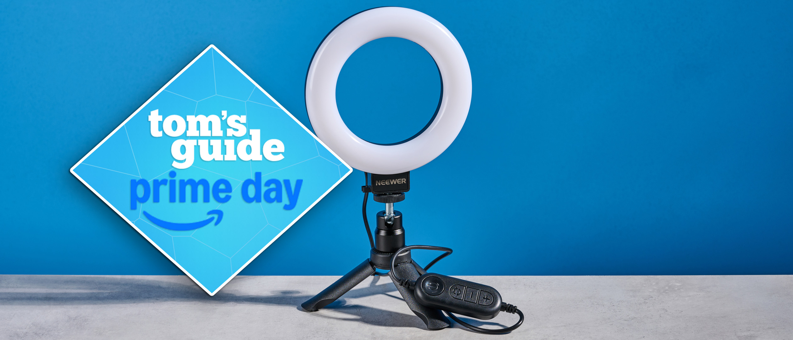 Neewer Basics BR60 5-inch Ring Light photographed in front of a blue background with a prime day tag to the left of the image