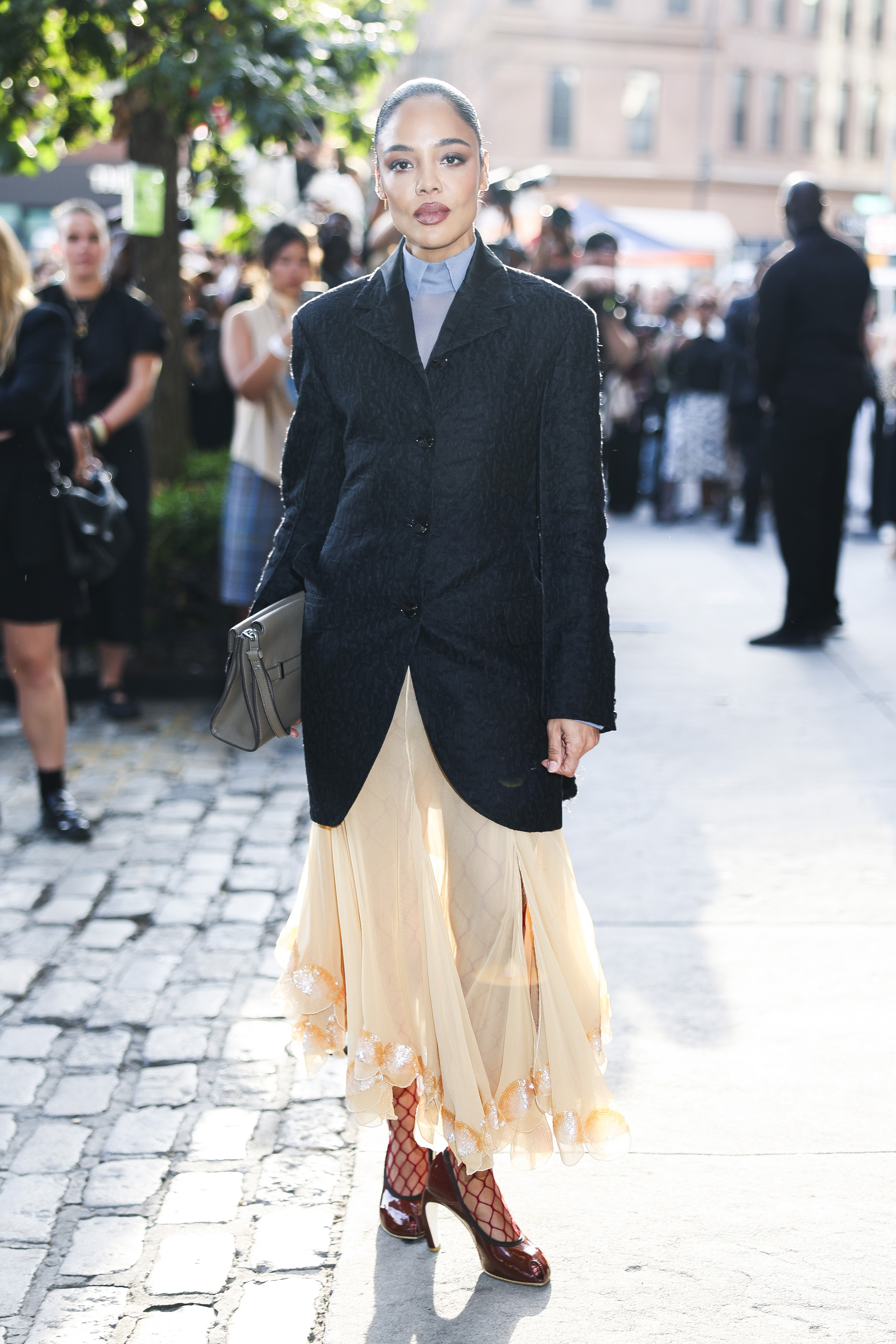 Tessa Thompson wearing burgundy shoes.