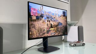 Alienware 27 AW2725Q monitor resting on a desk playing C2077