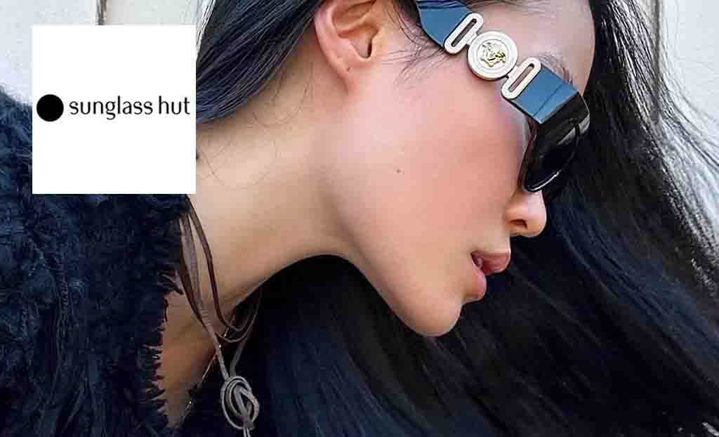 Sunglasses hut logo placed over an image of a side profile of a woman wearing sunglasses