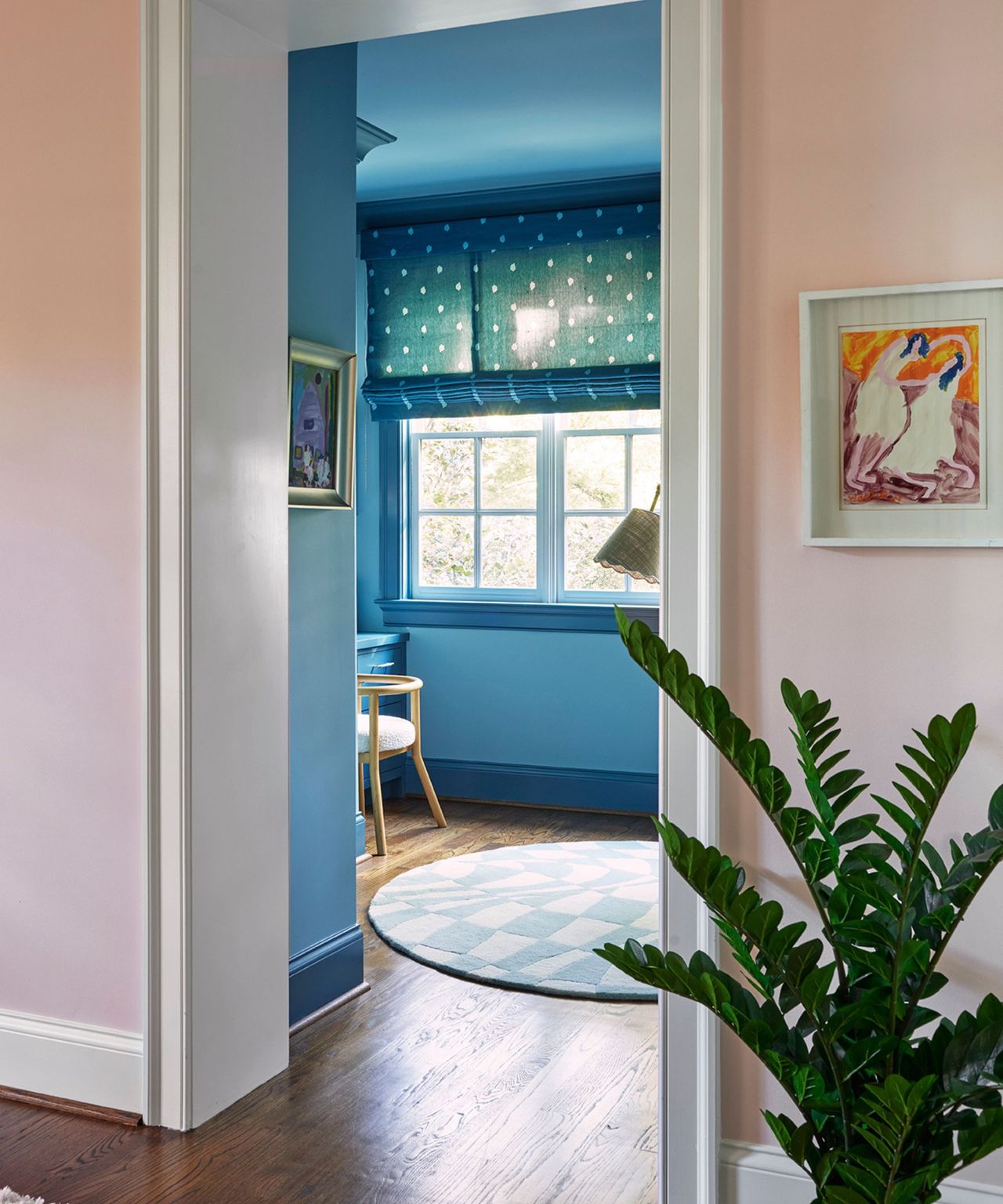 A light pink entry to a two-toned blue kid's room