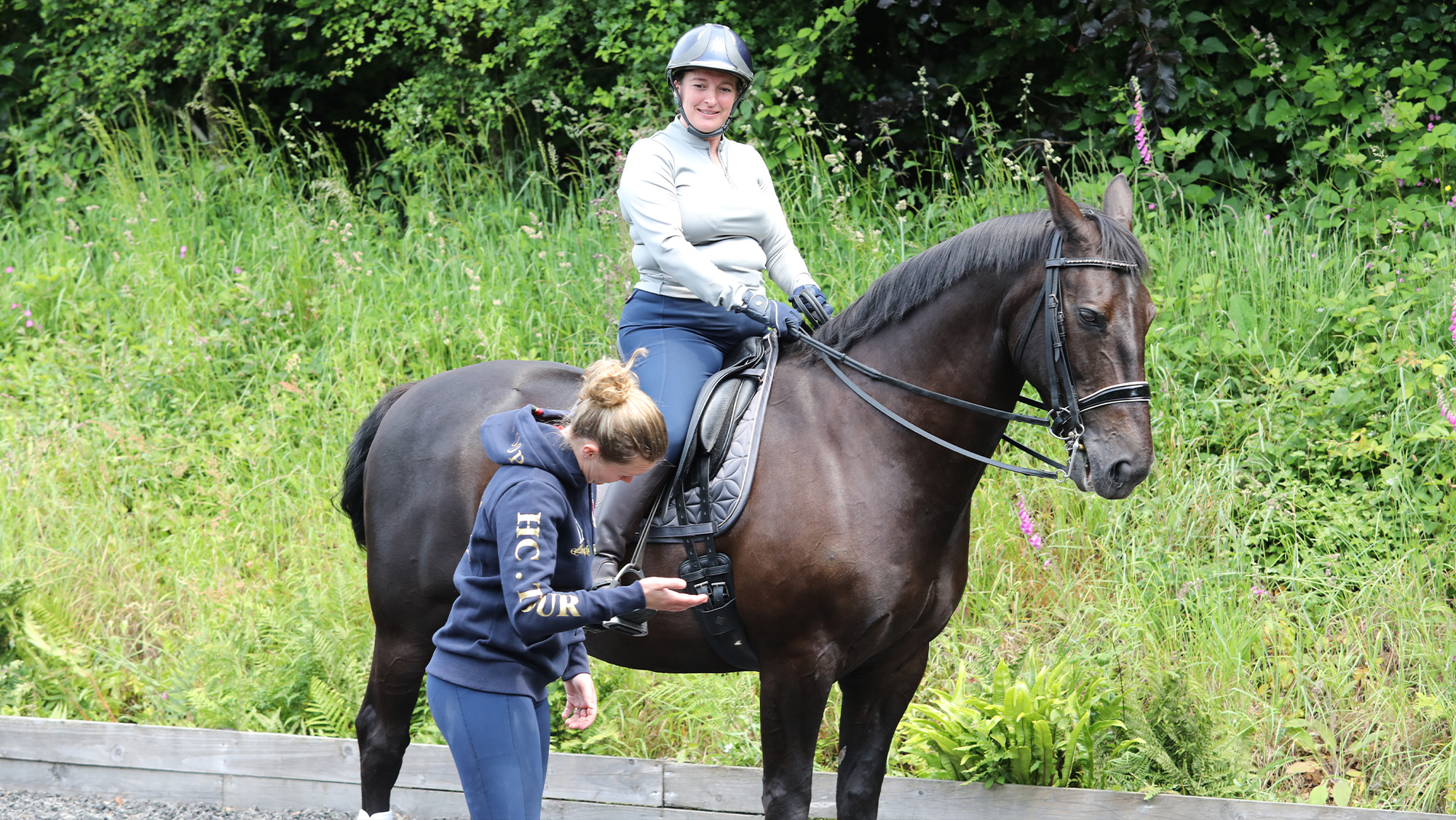Rider having dressage lesson with trainer