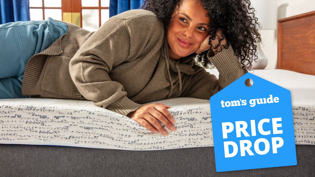 Lady laying on a Viscosoft Select High-Density Mattress Topper