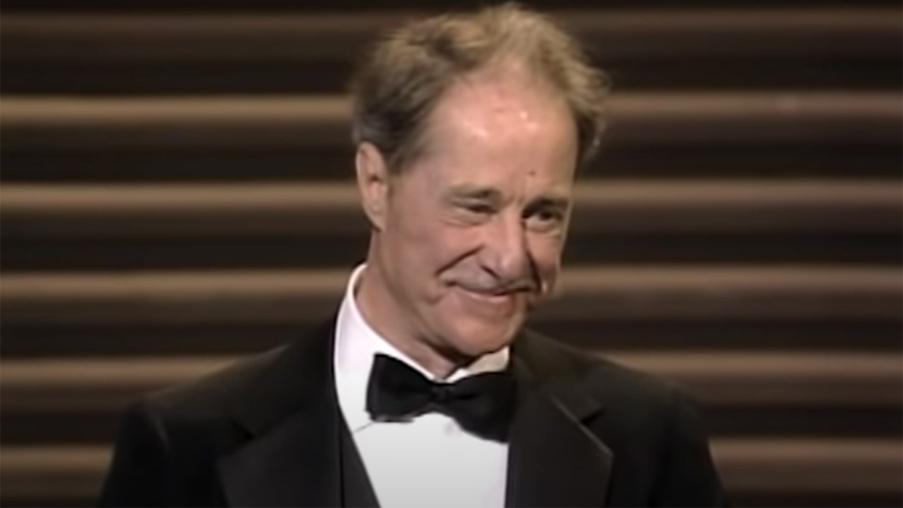 Don Ameche accepting an award for cocoon at the Oscars.