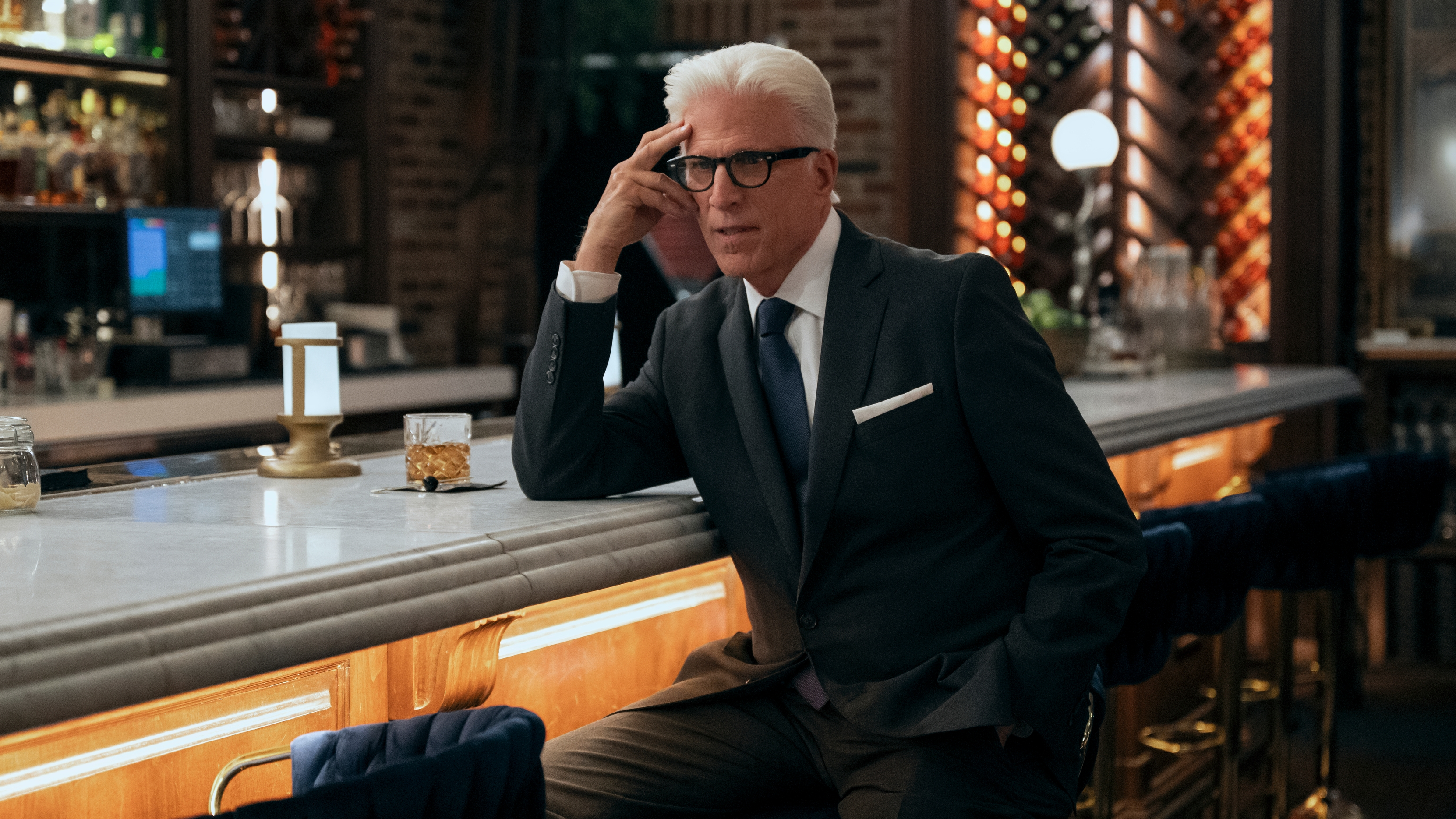 Charles (Ted Danson) sits at a bar in a scene from "A Man on the Inside" season 2