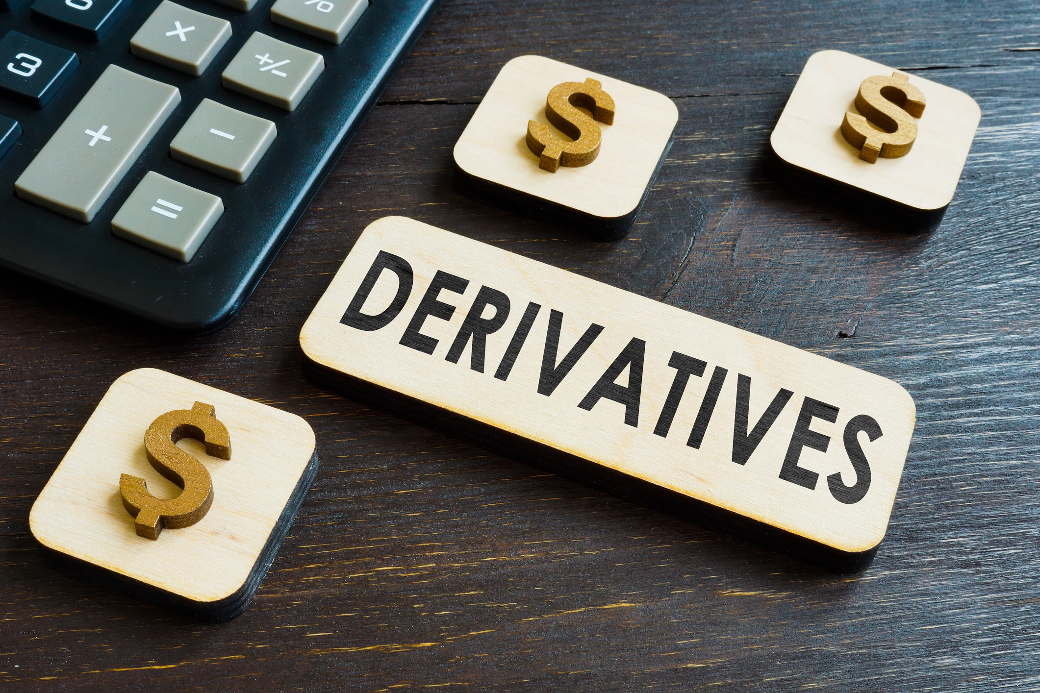 Derivatives word on the plate near calculator.