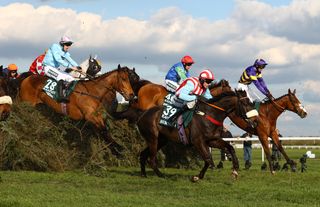 Corach Rambler (R) ridden by Derek Fox jumps the Chair in the Randox Grand National Chase during day three of the Randox Grand National Festival at Aintree Racecourse on April 15, 2023 in Liverpool