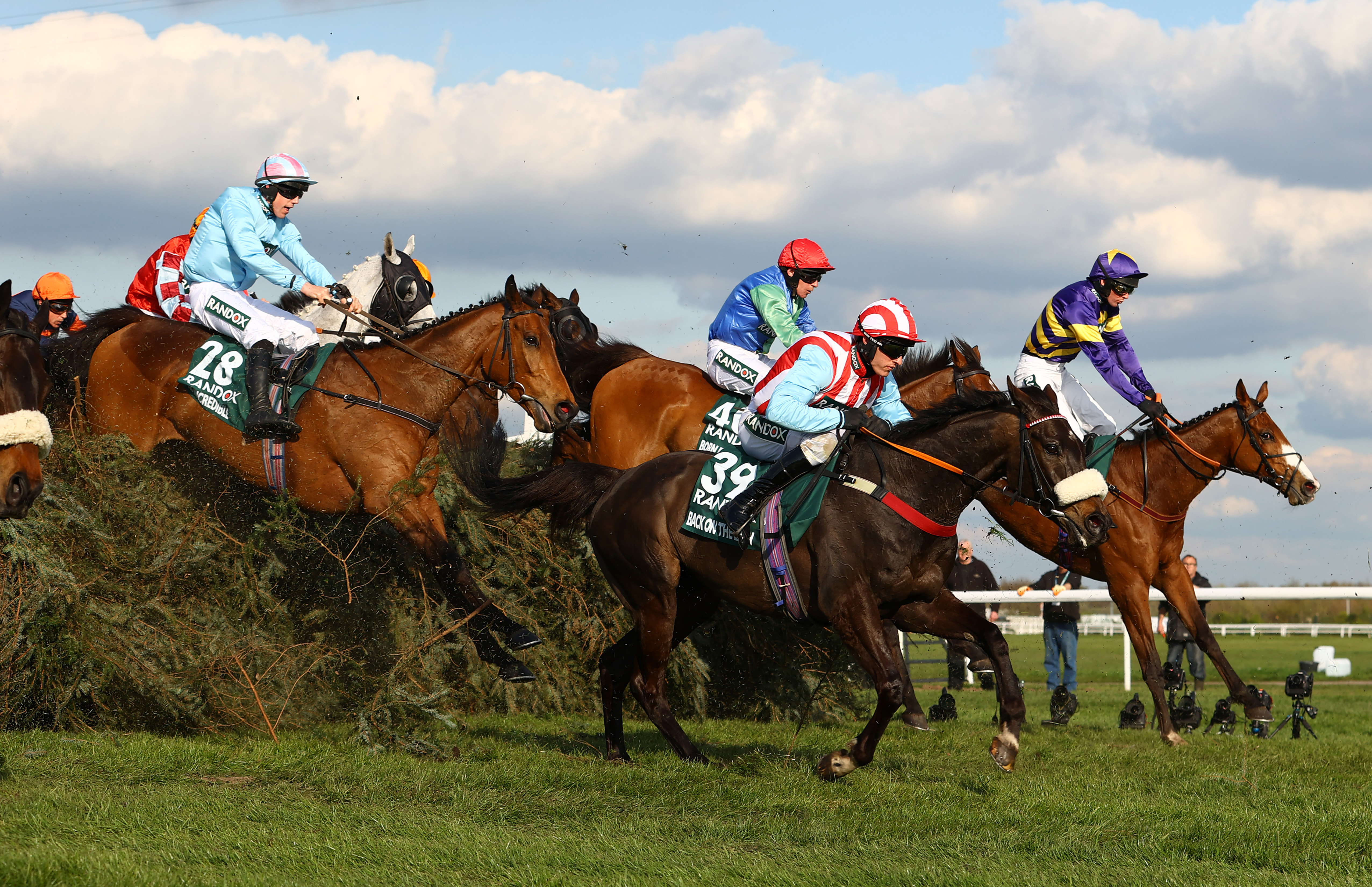 Corach Rambler (R) ridden by Derek Fox jumps the Chair in the Randox Grand National Chase during day three of the Randox Grand National Festival at Aintree Racecourse on April 15, 2023 in Liverpool