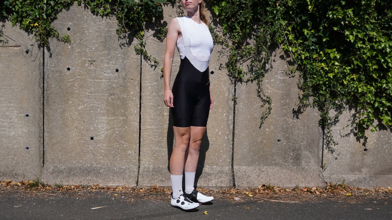 Female cyclist wearing the Jelenew Pinnacle Pro Bib Shorts 8&quot;