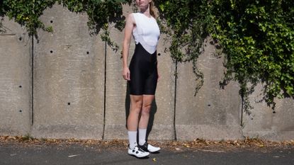 Female cyclist wearing the Jelenew Pinnacle Pro Bib Shorts 8"