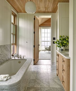 grey marble bathroom with wood cabinet