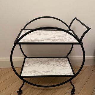 black frame bar cart with white and grey designed surface