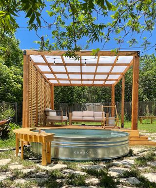 stock tank pool by Cowboy Pools with pergola