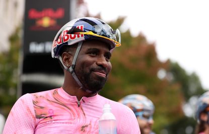 Justin Williams in a pink jersey and a red bull helmet