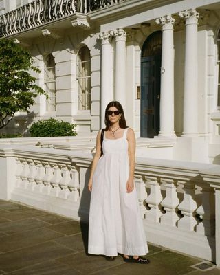 @francescasaffari wearing a white dress with black shoes