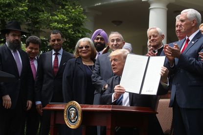 President Trump signs an executive order on religion