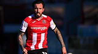 EXETER, ENGLAND - JANUARY 23: Ryan Bowman of Exeter City chases down the ball during the Sky Bet League Two match between Exeter City and Stevenage at St James Park on January 23, 2021 in Exeter, England. Sporting stadiums around the UK remain under strict restrictions due to the Coronavirus Pandemic as Government social distancing laws prohibit fans inside venues resulting in games being played behind closed doors. (Photo by Dan Mullan/Getty Images)