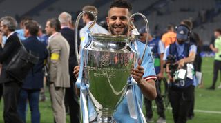 ISTANBUL, TURKEY - JUNE 10: Riyad Mahrez of Manchester City poses with the trophy following the 1-0 victory in the UEFA Champions League 2022/23 final match between FC Internazionale and Manchester City FC at Ataturk Olympic Stadium on June 10, 2023 in Istanbul, Turkey. (Photo by Jonathan Moscrop/Getty Images)