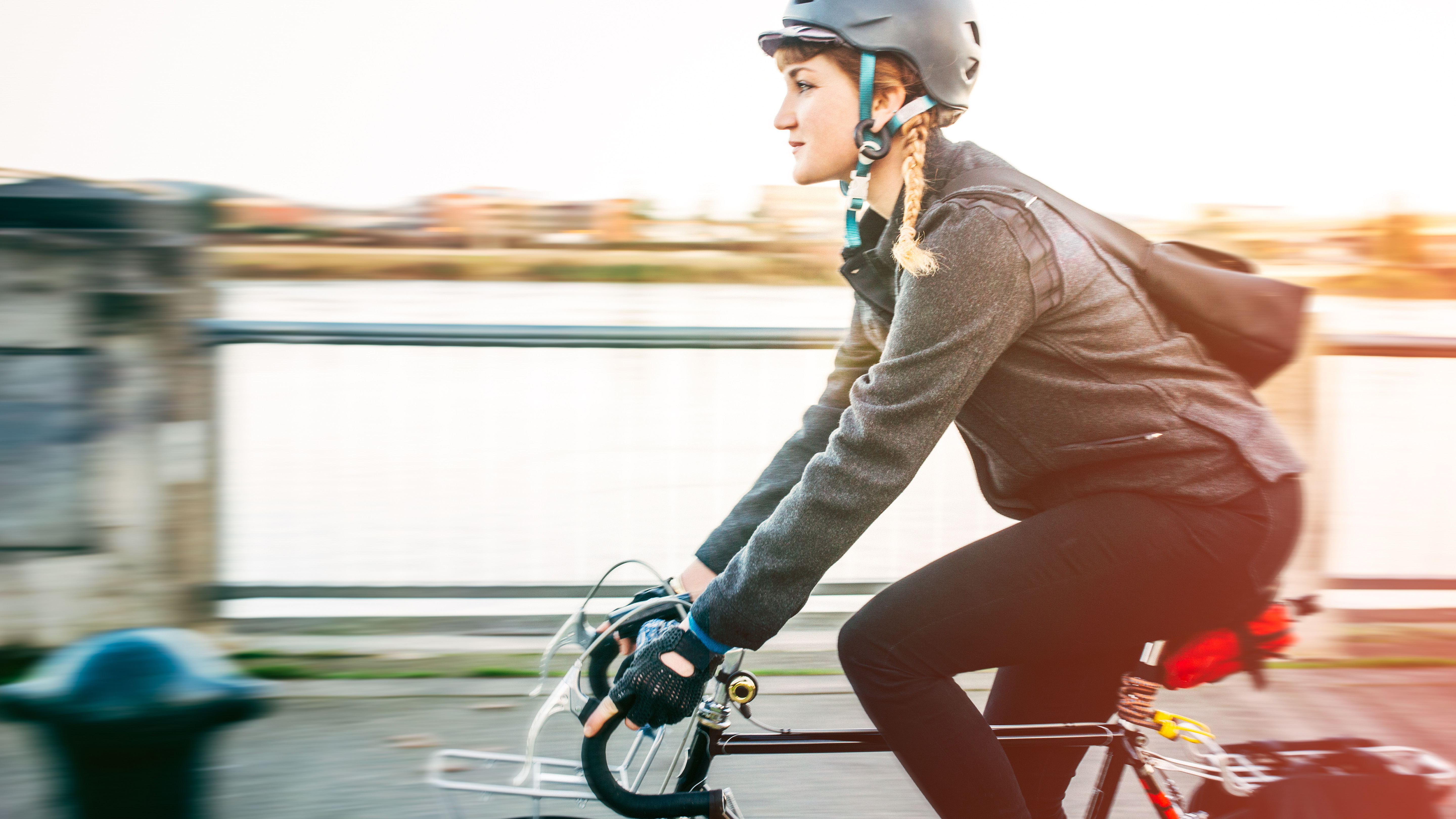A woman cycle commuting to work