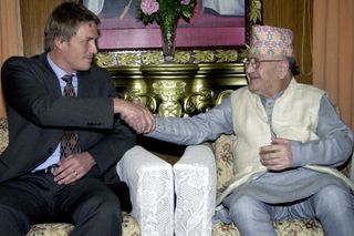 Nepalese Prime Minister Surya Bahadur Thapa (R) shakes hands with visiting Swedish Justice Minister Thomas Bodstrom in January 2004.