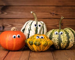funny multicoloured pumpkins with stick on googly eyes